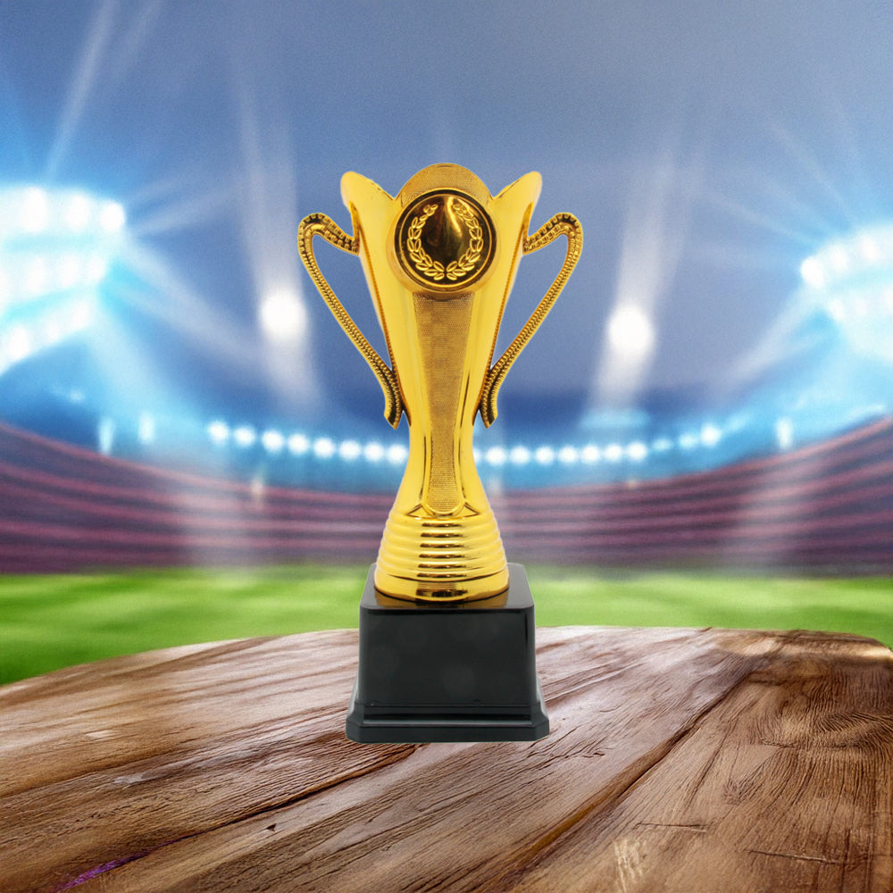 Trophy(CS-036) gold trophy on wooden base with blurred stadium background for recognition of achievement.