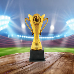 Trophy(CS-036) gold trophy on wooden base with blurred stadium background for recognition of achievement.