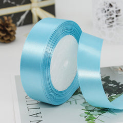 🧵 Premium Satin Ribbon – Versatile & Elegant in a light blue color, perfect for gift wrapping and crafts.