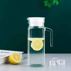 Glass Pitcher with Lid (1.1L) – Heat-Resistant Water Jug with lemon slices and ice cubes.