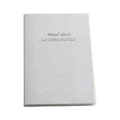 Glitter Note Pad(18K/17.5*24.2CM) featuring a shimmering silver cover with a motivational quote.