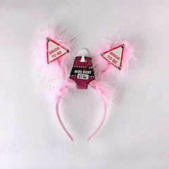 Hens Night Hair Band with pink fluffy ears and 'Bride to Be' signs for bachelorette parties.