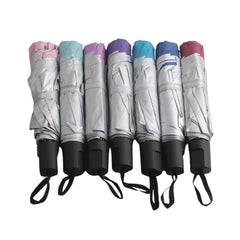 ☔ Foldable Compact Umbrella – Rainproof Travel Size (Q) in assorted colors, neatly folded and ready for travel.
