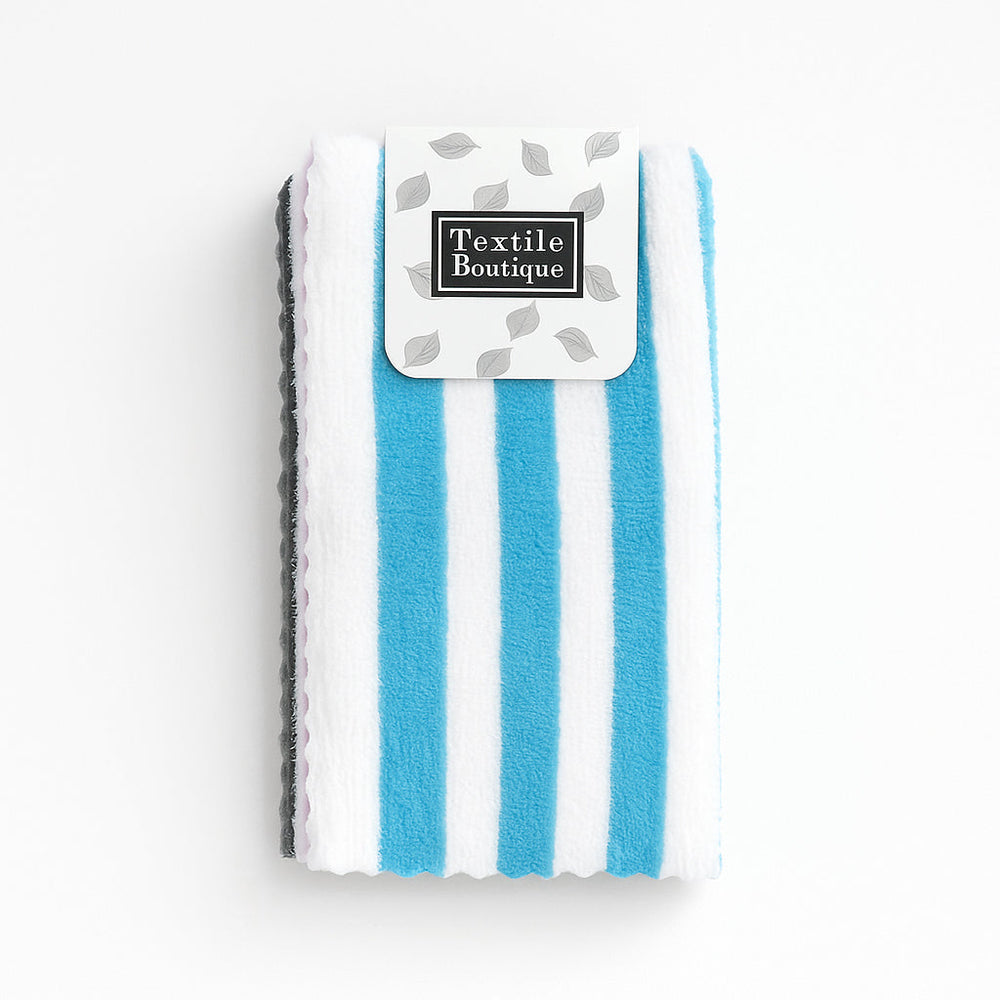 Striped Microfiber Towel displayed with a label from Textile Boutique, featuring blue and white stripes.