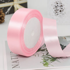 🧵 Premium Satin Ribbon – Versatile & Elegant in soft pink, perfect for gift wrapping and crafting projects.