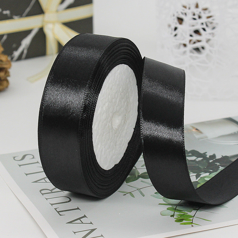🧵 Premium Satin Ribbon – Versatile & Elegant in black color, ideal for creating elegant bows and decorations.