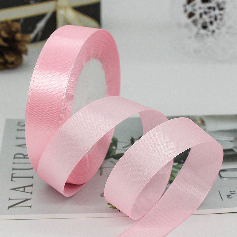 🧵 Premium Satin Ribbon – Versatile & Elegant in soft pink color, perfect for gift wrapping and DIY projects.