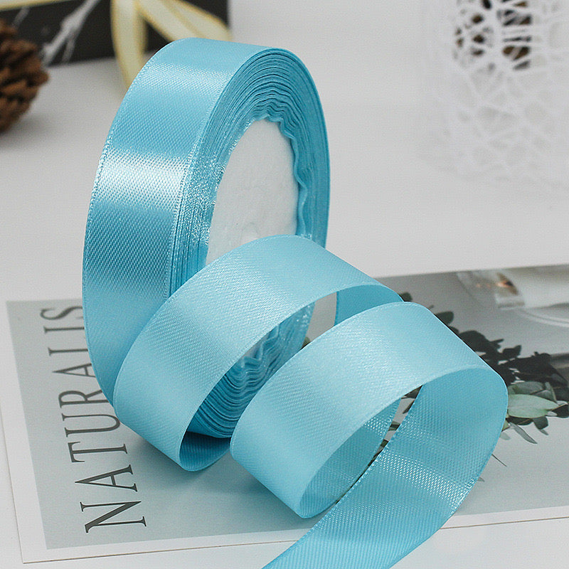 🧵 Premium Satin Ribbon – Versatile & Elegant in light blue color, perfect for gift wrapping and DIY crafts.