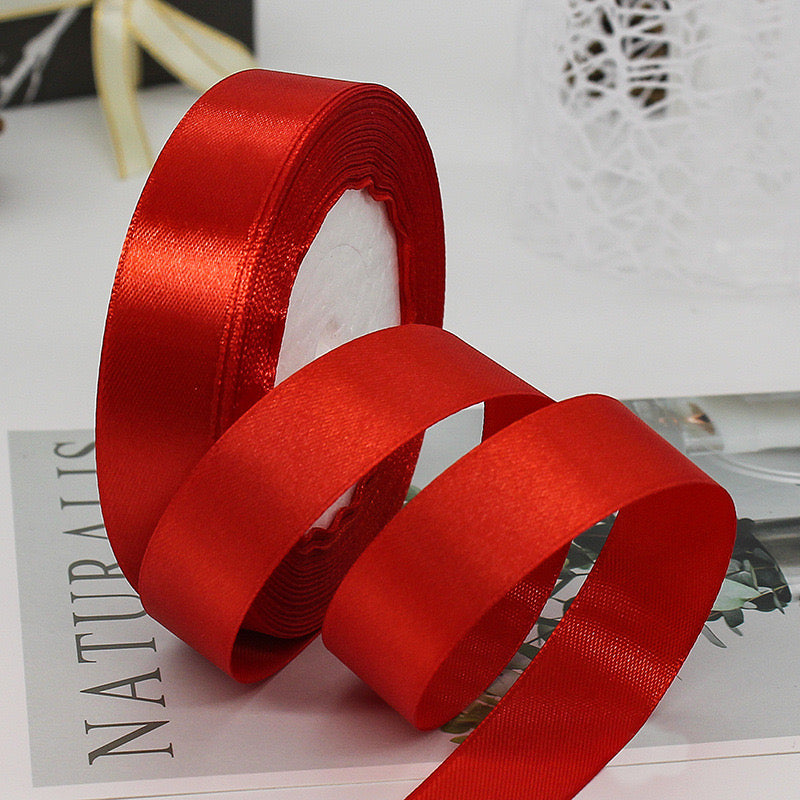 🧵 Premium Satin Ribbon – Versatile & Elegant in vibrant red, perfect for gift wrapping and craft projects.