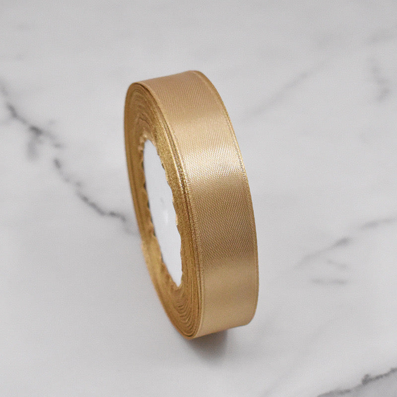 🧵 Premium Satin Ribbon – Versatile & Elegant in gold, perfect for gift wrapping and DIY craft projects.