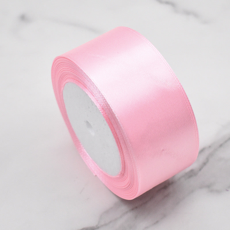 🧵 Premium Satin Ribbon – Versatile & Elegant in soft pink color, perfect for gift wrapping and crafting projects.