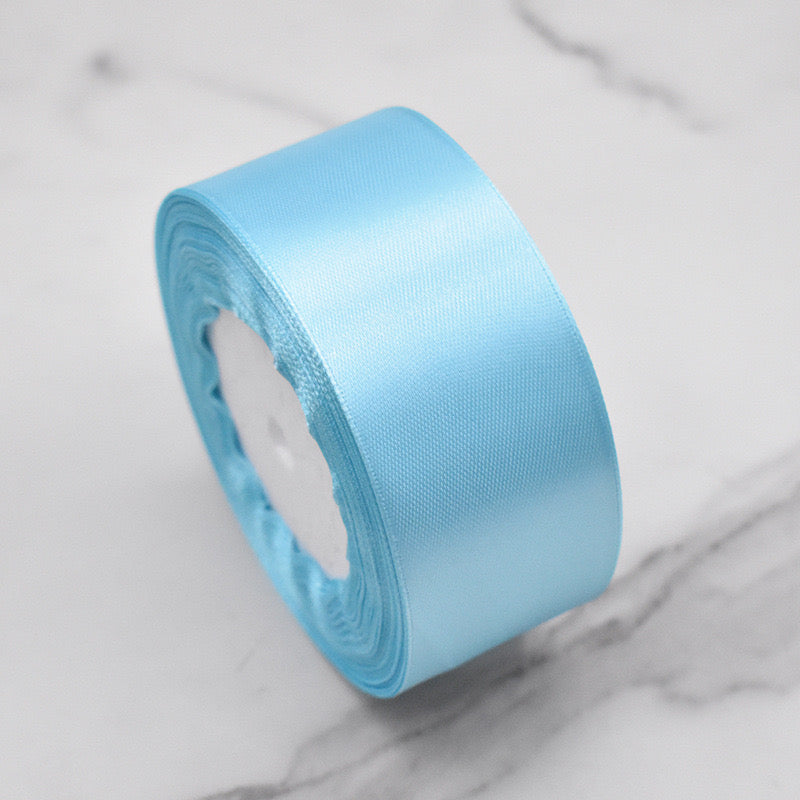 🧵 Premium Satin Ribbon – Versatile & Elegant in soft blue color, perfect for gift wrapping and craft projects.