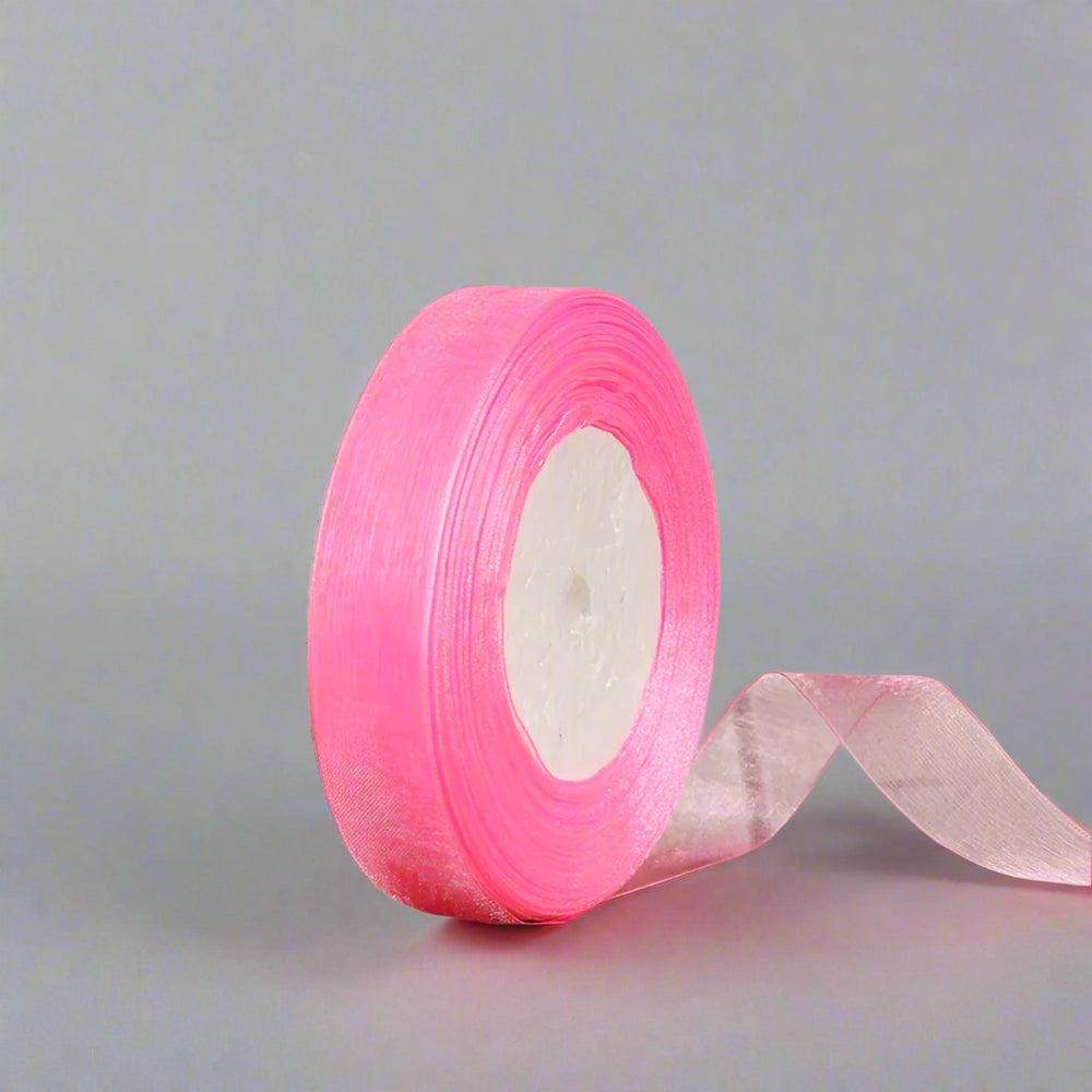 🎀 Sheer Organza Ribbon – Elegant & Versatile Finish in vibrant pink on a spool with a delicate sheer texture.