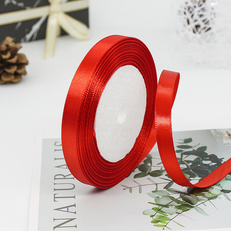 🧵 Premium Satin Ribbon – Versatile & Elegant on a craft table, perfect for gift wrapping and DIY projects.