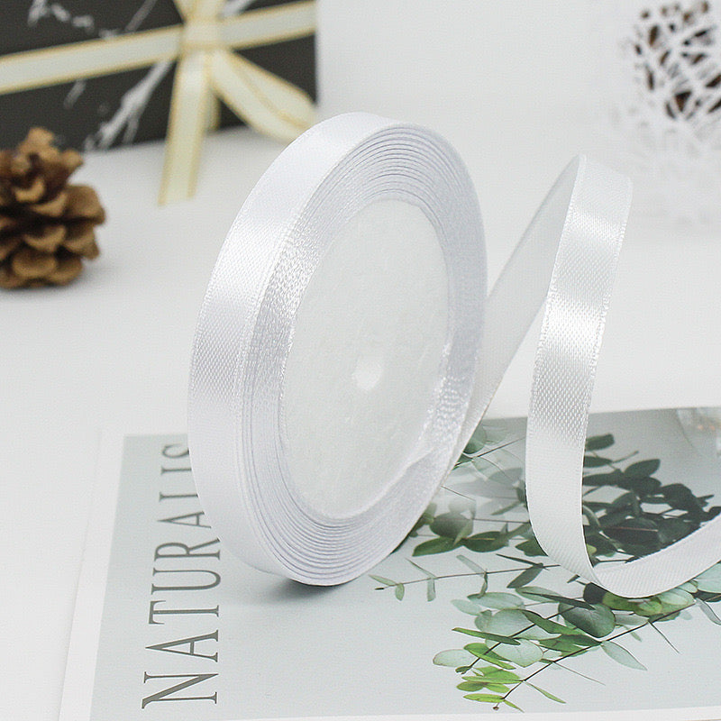 🧵 Premium Satin Ribbon – Versatile & Elegant on a magazine page, perfect for gift wrapping and crafts.