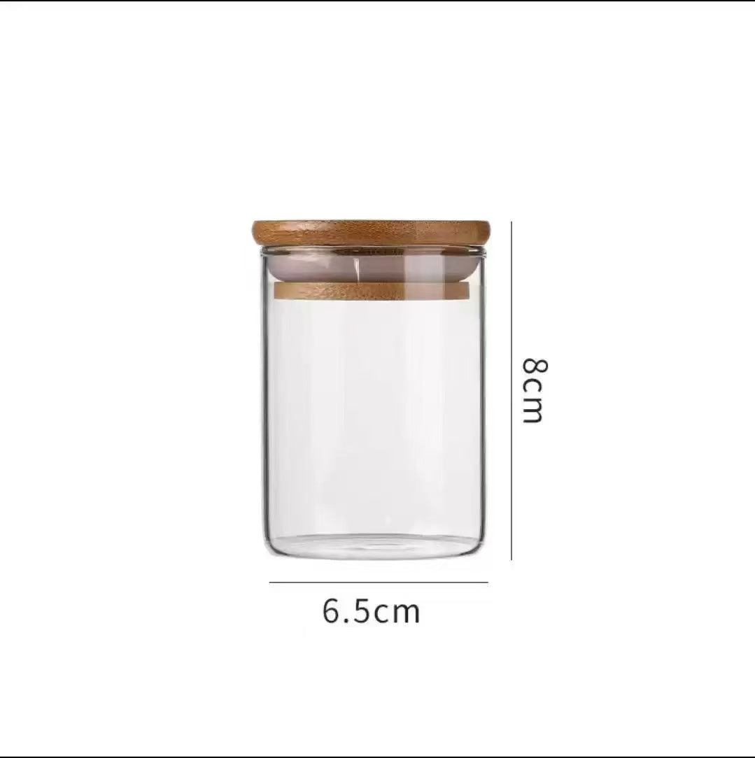 Glass Storage Jar with Wooden Lid(6.5*8CM) showcasing a clear design with a wooden lid and dimensions of 6.5cm by 8cm.