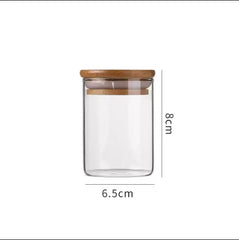 Glass Storage Jar with Wooden Lid(6.5*8CM) showcasing a clear design with a wooden lid and dimensions of 6.5cm by 8cm.